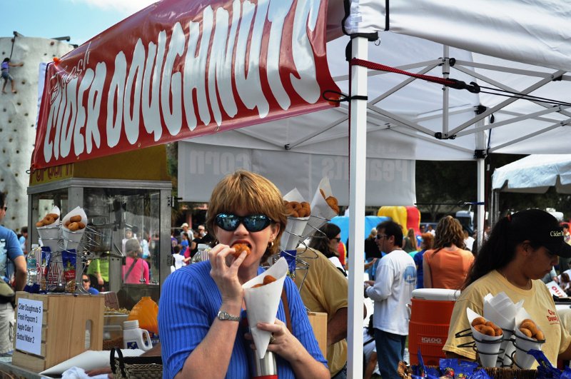 DSC_0032.jpg - Theresa, W4JKJ XYL, munching on some Cider doughnuts which are realllly good!