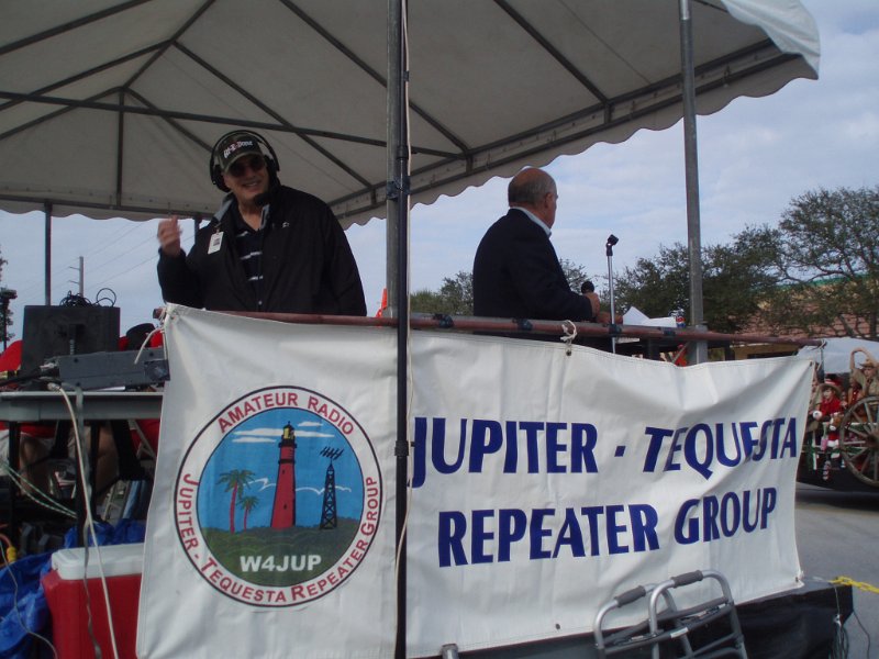 PC140240.JPG - Bob-KF2GQ in the judges stand providing Net Control for the Jupiter, Florida's Holiday Parade.