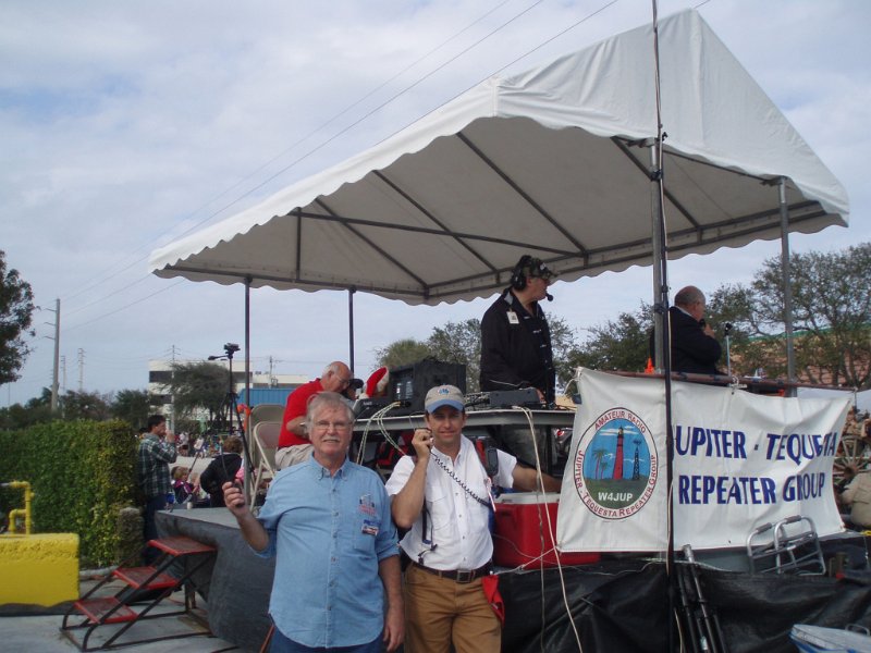 PC140241.JPG - Fred-KD4QHI, Kevin-W4JKJ, and Bob-KF2GQ (Holiday Parade Net Control) in background in the judges stand.