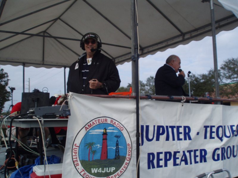 PC140242.JPG - Bob-KF2GQ in the judges stand providing Net Control for the Jupiter, Florida's Holiday Parade.